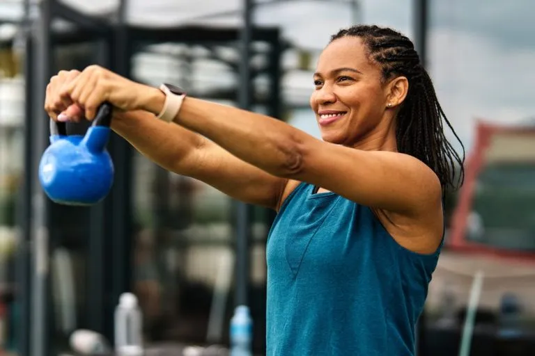 Women lifting kettle bell