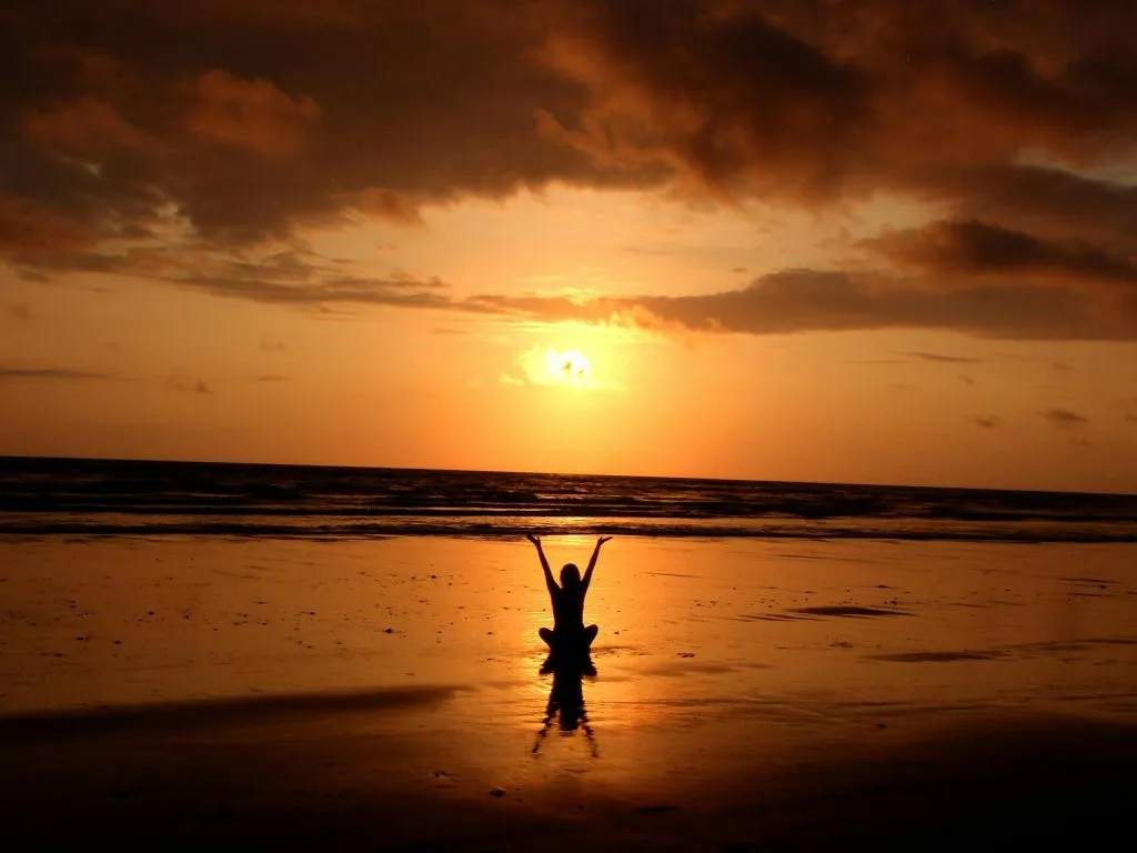 Sitting on a beach with the sunrise