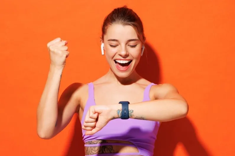 Girl exercising looking at watch